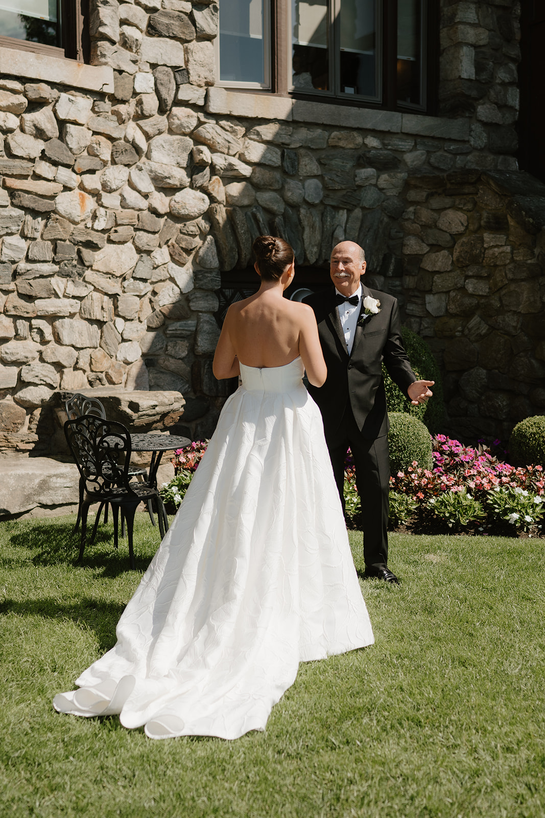 Emotional father-daughter first look outside the stone walls of Le Chateau.